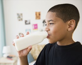 Hispanic boy drinking milk