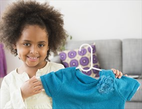African American girl showing new shirt