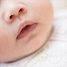 Close up of Caucasian baby's mouth and nose