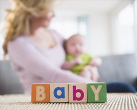 Close up of wooden blocks spelling 'baby'