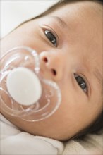 Hispanic infant with pacifier
