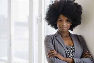 Mixed race businesswoman smiling