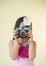 Korean girl using retro camera