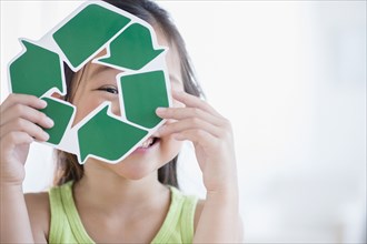Korean girl holding recycle symbol