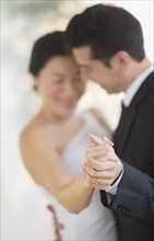 Newlywed couple dancing at wedding reception