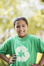 Mixed race girl wearing recycling t-shirt outdoors