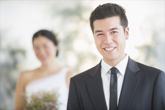Groom smiling in wedding ceremony