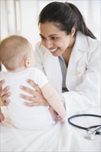 Doctor smiling at baby