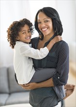 Portrait of smiling African American mother and daughter