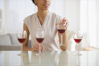 Black woman tasting wine