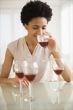 Black woman tasting wine