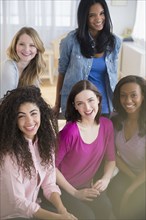 Women smiling together in living room