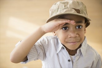 African American boy giving salute