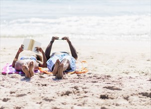 Couple relaxing together on beach