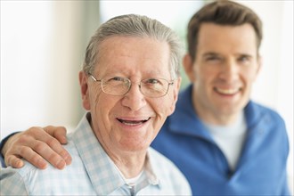 Caucasian father and son smiling