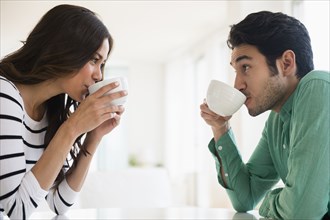 Couple drinking coffee together