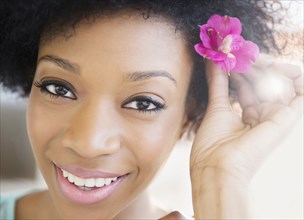 African American woman wearing flower in hair