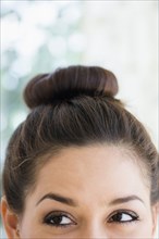 Close up of woman wearing a bun