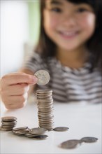 Filipino girl counting coins