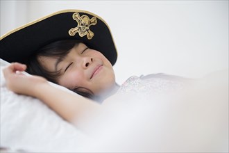 Filipino girl sleeping in dress-up costume