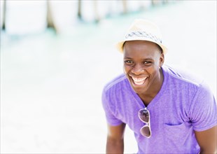Mixed race man at beach