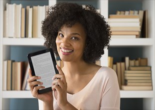 Woman holding digital tablet with e