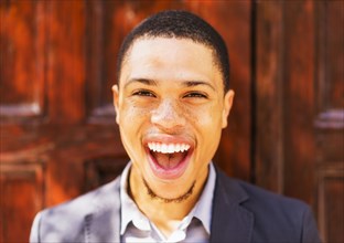 Black businessman smiling outdoors