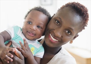 Close up of Black mother and son smiling