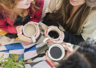 High angle view of women drinking coffee