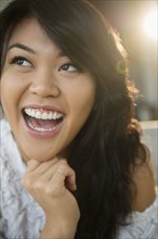 Close up of Pacific Islander woman laughing