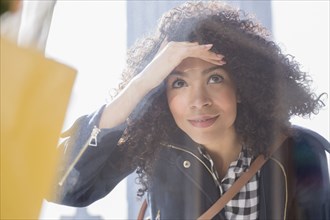 Mixed race woman window shopping