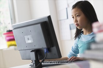 Chinese student using desktop computer