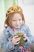 Caucasian girl drinking healthy juice