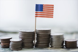 Close up of stacks of coins with American flag