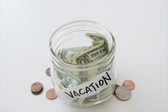 Close up of vacation savings jar