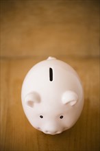 Close up of piggy bank on table