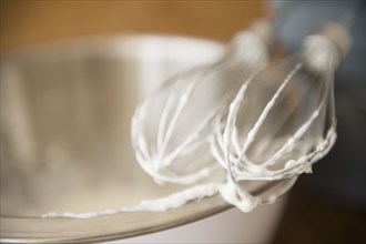 Close up of electric mixer whipping cream