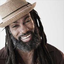 Close up of Black man with dreadlocks laughing