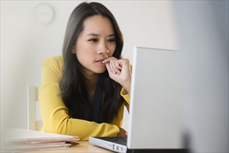 Chinese businesswoman using laptop