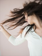 Chinese woman tossing her hair