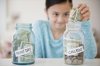 Girl saving money in college fund