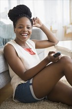 Black woman watching television