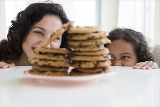 Mother and daughter admiring cookies