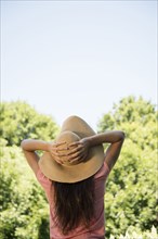 Caucasian woman wearing sun hat outdoors