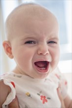 Caucasian baby girl crying