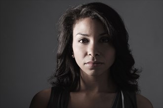 Mixed race woman with serious expression