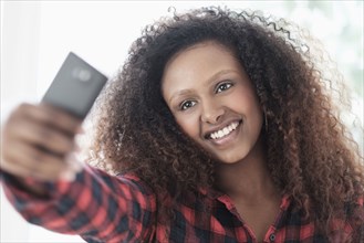 Black woman taking selfie