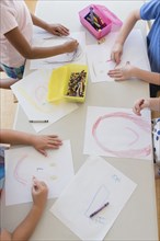 Students drawing in classroom