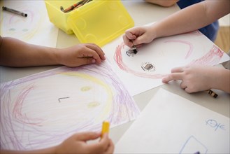 Students drawing in classroom