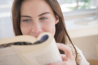 Native American woman reading book